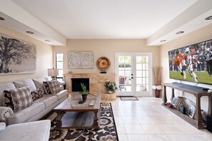 TV, fireplace, books