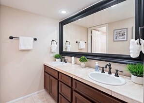 Shower, hair dryer, towels, shampoo