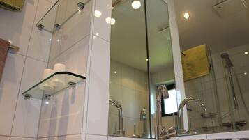 Shower, hair dryer, towels, toilet paper
