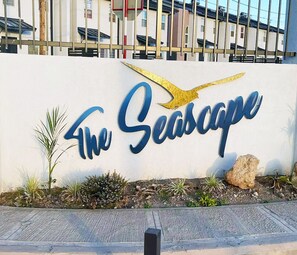 A sign for "The Seascape" with a stylized bird graphic. - Cozy Crib 5mins from the airport (Kingston)