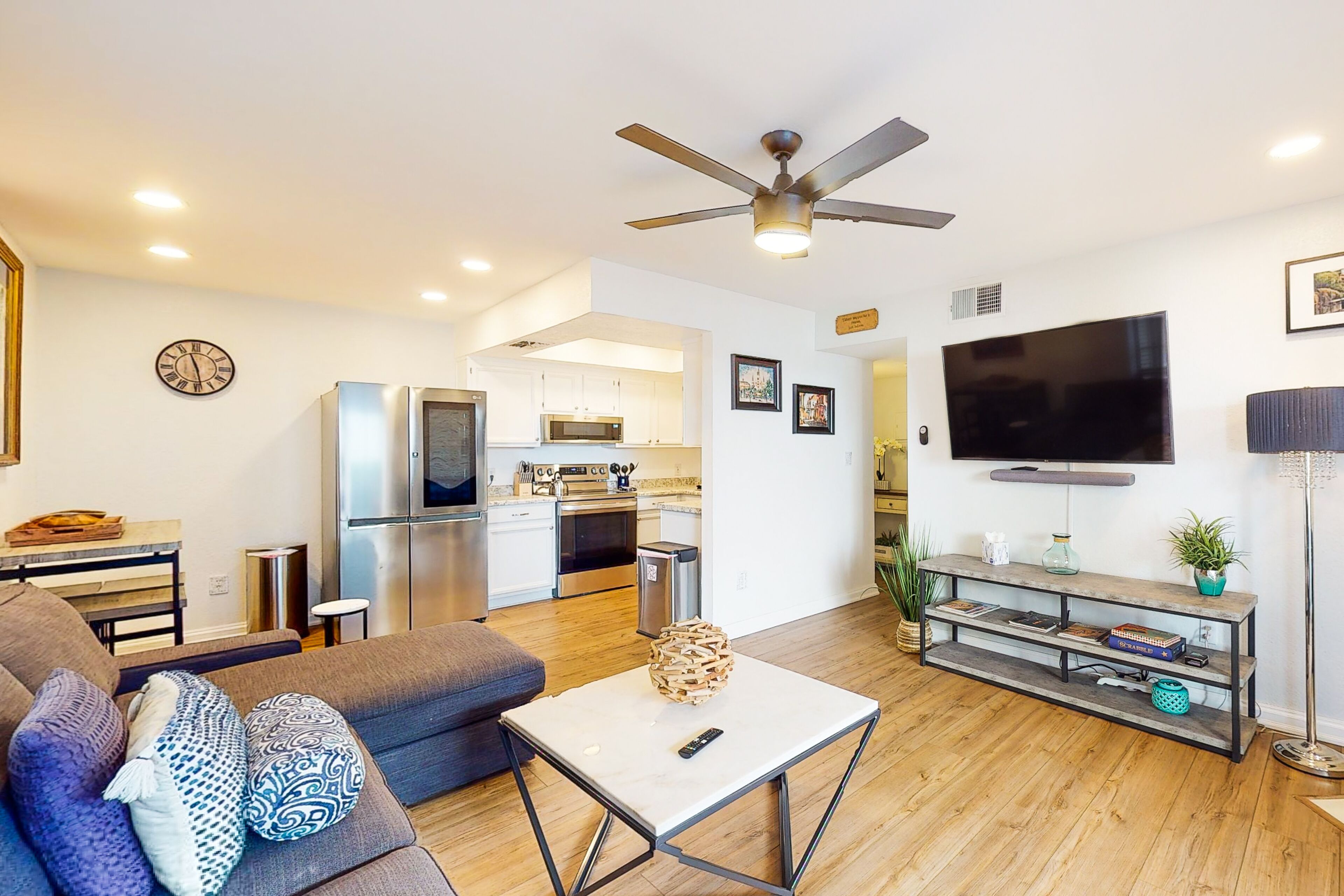 Modern condo with a private balcony, washer/dryer, central AC, & shared pool