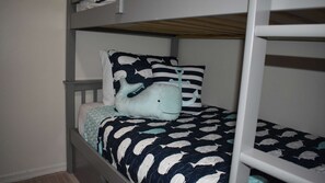 A bunk bed with a nautical-themed bedspread and pillows, including an anchor-shaped pillow. - 3bed/2bath pool home, sleeps 8 guests, great location, private/sunny aspect. (Davenport)