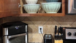 A kitchen with a built-in oven, a toaster, and a countertop with a knife block. - A Family Cozy Getaway 7 miles from Sea World and Fiesta, Texas (San Antonio)