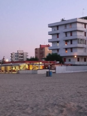 On the beach, sun-loungers