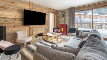 Télévision, cheminée, services de streaming, chaßne hi-fi