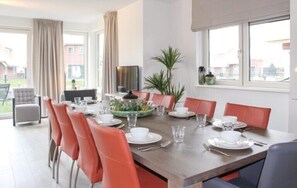 Enjoy meals in this inviting dining area with a large table and comfortable seating for six.