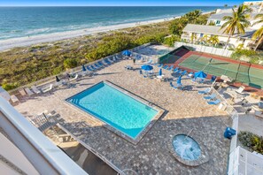 Outdoor pool, a heated pool - Beachfront w/ Views! 🏝 Kid & Pet-friendly, Heated Pool, Spa, Pickle Ball/Tennis (Indian Rocks Beach)