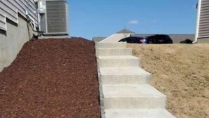 A set of concrete steps leading up to a house. - Entire Studio Apt + Patio + Lake View + Private (Charlotte)