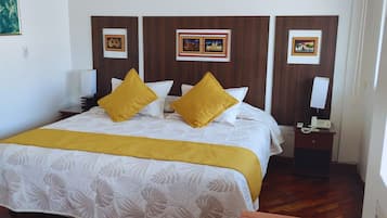 Premium bedding, desk, laptop workspace, blackout curtains