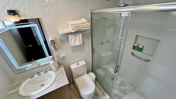 Superior Room | Bathroom | Hair dryer, towels, soap, shampoo