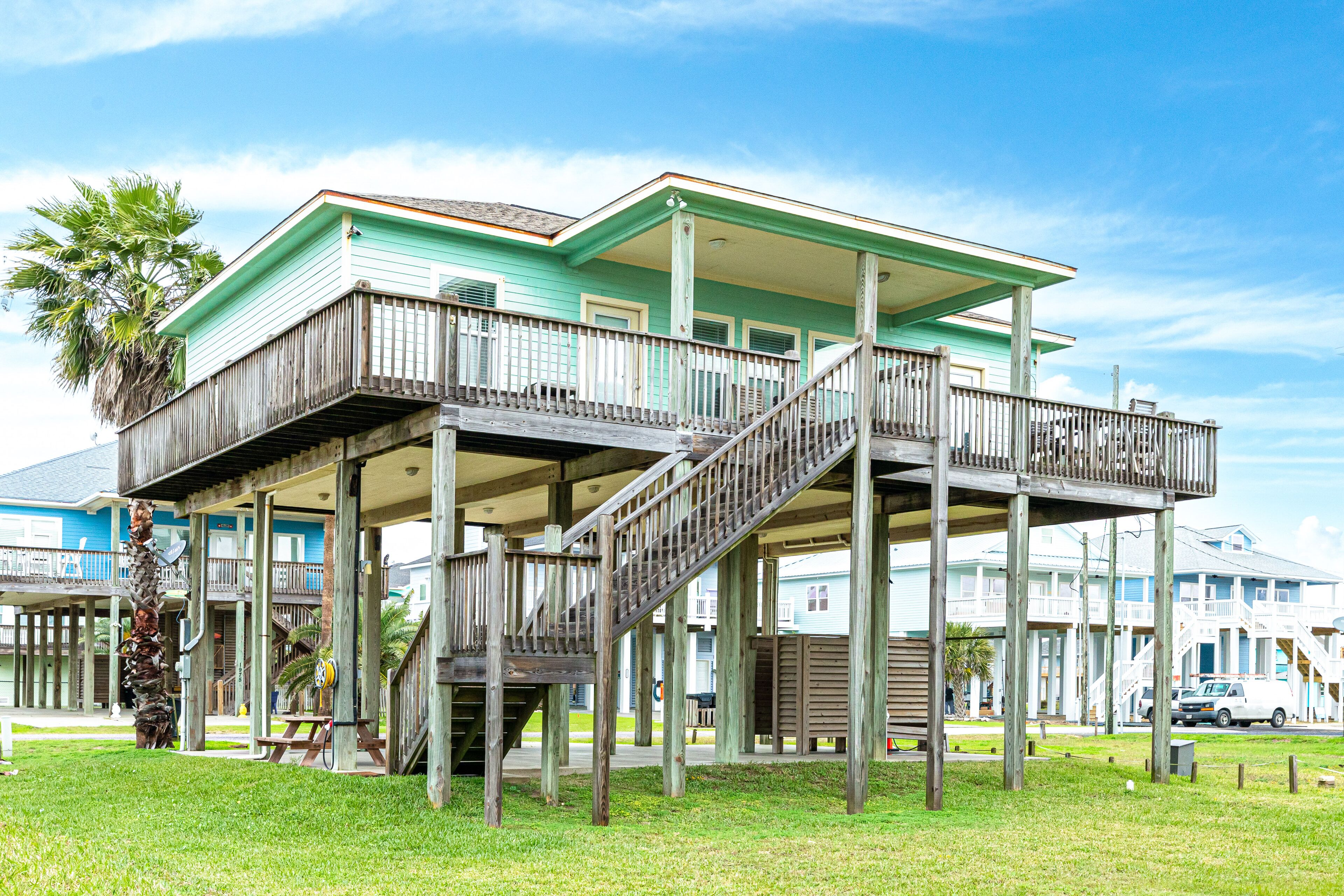 Gulf-view dog-friendly home with beach access, deck, outdoor shower, W/D, & AC