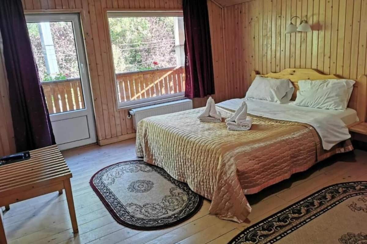 Deluxe kamer, Meerdere bedden, niet-roken, balkon | 1 slaapkamer, gratis wifi
