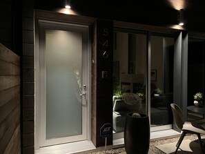 A modern exterior with a frosted glass door, a number sign, and a sign indicating a custom home. - Architectural Modern Venice Beach Home-walk to beach and fabulous restaurants !! (Los Angeles)