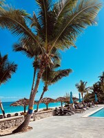 Private beach, white sand, free beach cabanas, beach massages