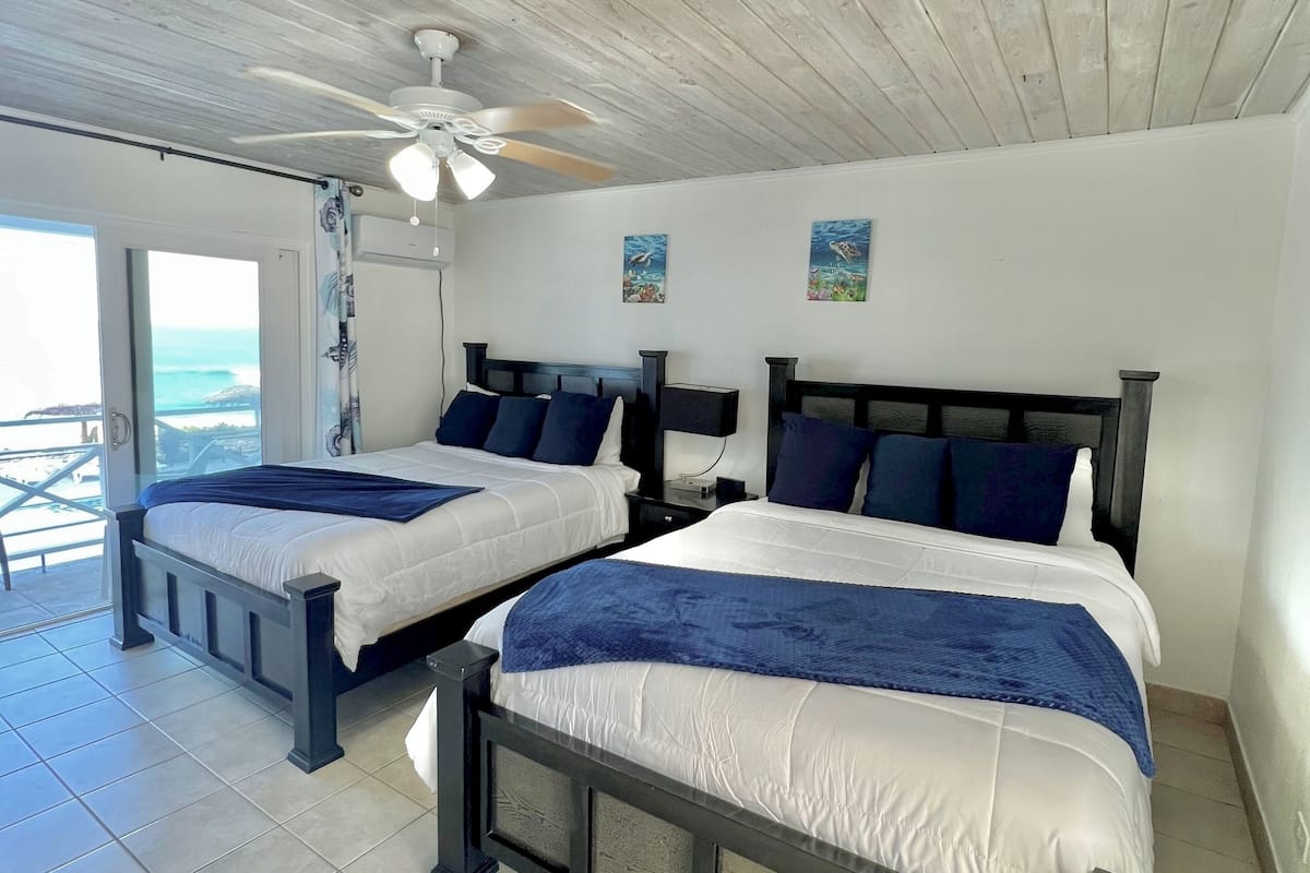 Standard Double Room, 2 Queen Beds, Ocean View, Beachfront | Minibar, in-room safe, individually decorated, individually furnished