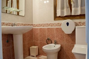 Bidet, towels, soap, shampoo