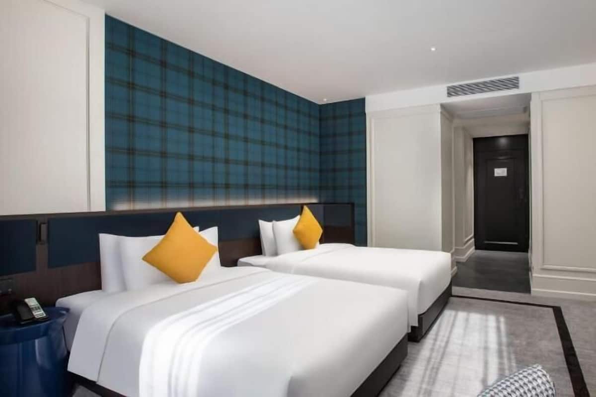 Premium bedding, down comforters, pillowtop beds, free minibar