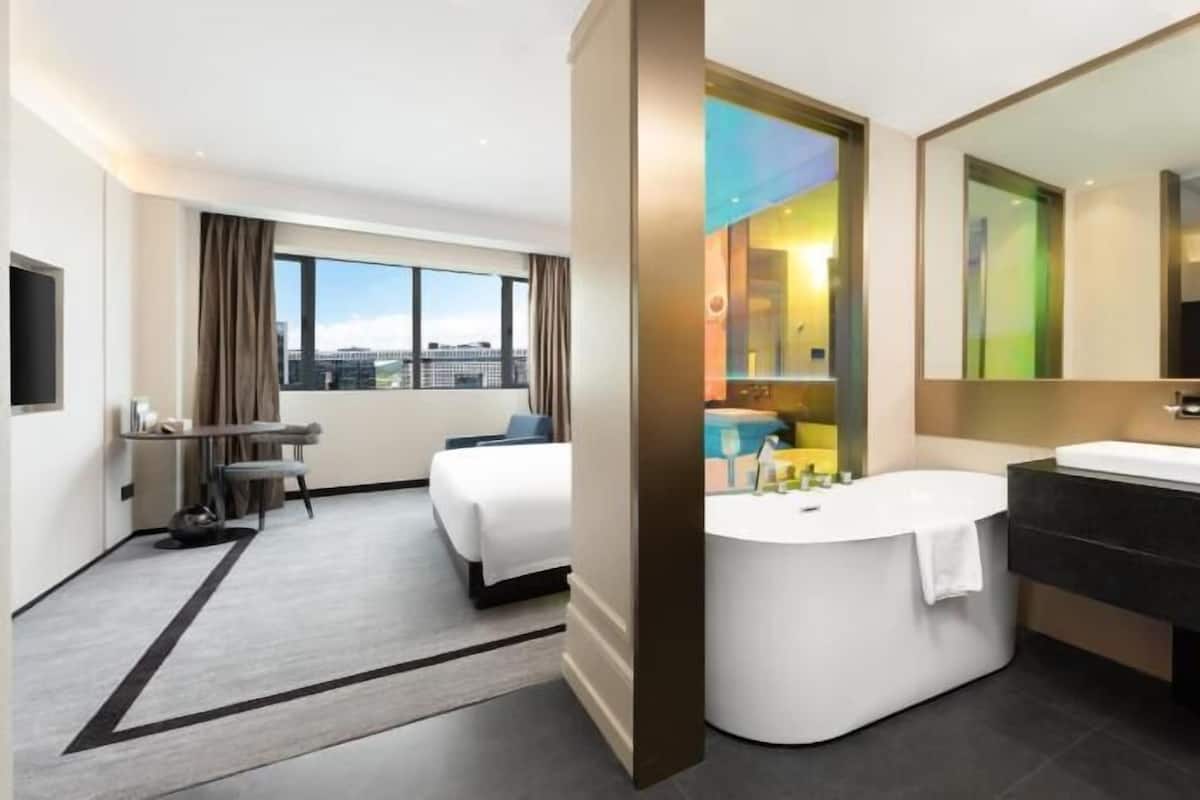 Premium bedding, down comforters, pillowtop beds, free minibar