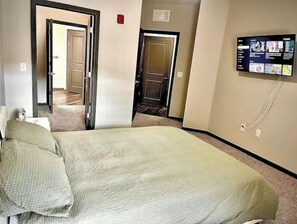Relax in this cozy retreat with a comfortable bed and flat-screen TV.