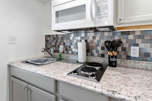 Junior Single Room, 1 Queen Bed, Kitchenette, Ground Floor | Private kitchen | Full-size fridge, microwave, stovetop, coffee/tea maker