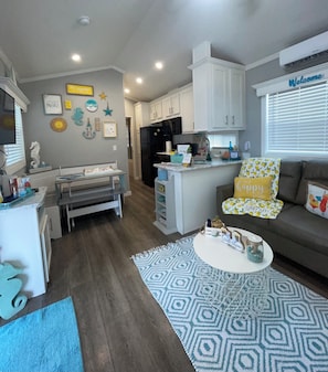 Cozy living space with a kitchen, dining area, and comfortable seating.