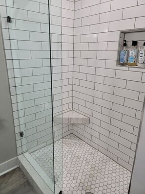 Hair dryer, towels, shampoo, toilet paper