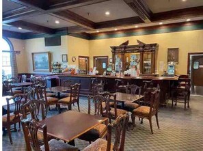 Relax in our classic lobby, featuring a bar area with seating and a selection of drinks.