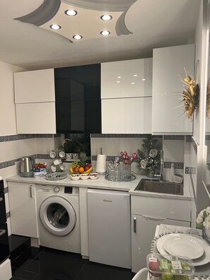 Fridge, microwave, electric kettle, cookware/dishes/utensils