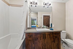 Combined shower/tub, hair dryer, towels, soap