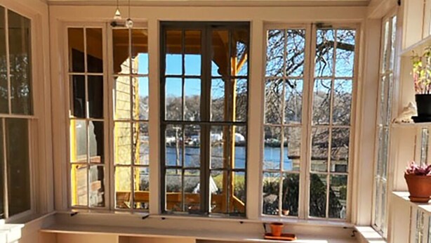A room with a large bay window, a ceiling fan, and a bench. - Amazing experience near the Quinnipiac River. Historic w/chef's kitchen & bidet. (New Haven)