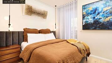 1 bedroom, desk, iron/ironing board, travel crib