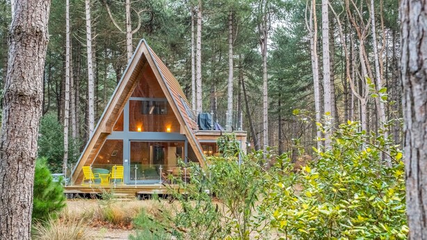 A modern, triangular wooden cabin in a forest. - Woodpecker, Weybourne, Norfolk (Weybourne)