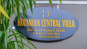 A sign for Hoi An Central Villa with contact information. - HOIANIAN CENTRAL VILLA (Da Nang)