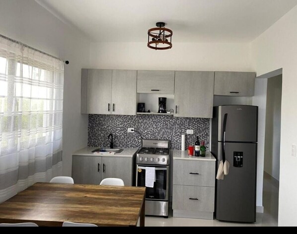 Fridge, stovetop, coffee/tea maker, toaster