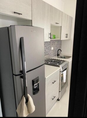 Fridge, stovetop, coffee/tea maker, toaster