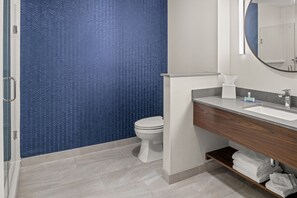 Separate bathtub and shower, hair dryer, towels, soap