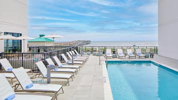 Outdoor pool, open 8:00 AM to 9:00 PM, pool umbrellas, pool loungers