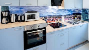 Panoramic Apartment | Private kitchen | Full-sized fridge, microwave, oven, stovetop