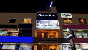 A hotel named Greenotel with a sign advertising Premium AC Rooms and Quad AC Rooms. - Greenotel Rooms, Hazira, Surat (Surat)