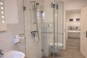 Shower, hair dryer, towels, soap