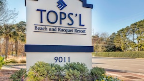 A sign for TOPS'L Beach and Racquet Resort with the address 9011. - Tops'l Summit 812 ~ Gulf views and quick walk to the beach (Miramar Beach)