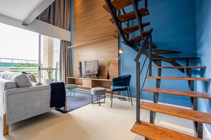 Deluxe Duplex | Living area | 40-inch Smart TV with digital channels, TV