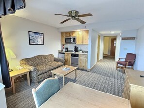 TV, fireplace, offices - Grand Lodge 565 — Top-Floor Crested Butte Studio, Pool, Hot Tub, Walk to Lifts (Crested Butte)