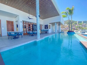 A modern pool area with a clear view of the surrounding hillside. - Chic 1BR in Romantic Zone w/pool (Puerto Vallarta)