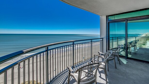 A balcony with a view of the ocean, metal railings, and outdoor furniture. - 🌊Newly Renovated Oceanfront | Awesome Amenities | Caribbean Resort 803🌊 (Myrtle Beach)