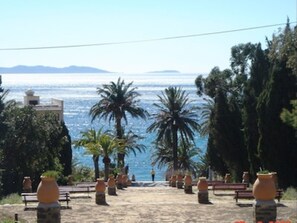 Stroll along the scenic promenade, taking in breathtaking views of the sea and distant mountains.