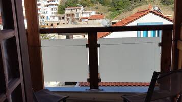 Basic Double or Twin Room | Living area | Flat-screen TV