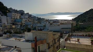 A coastal town with buildings and a sea view.