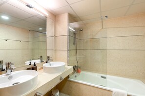 Bathtub, hair dryer, towels