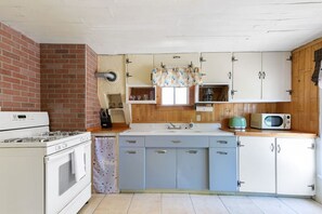 Fridge, coffee/tea maker, cookware/dishes/utensils